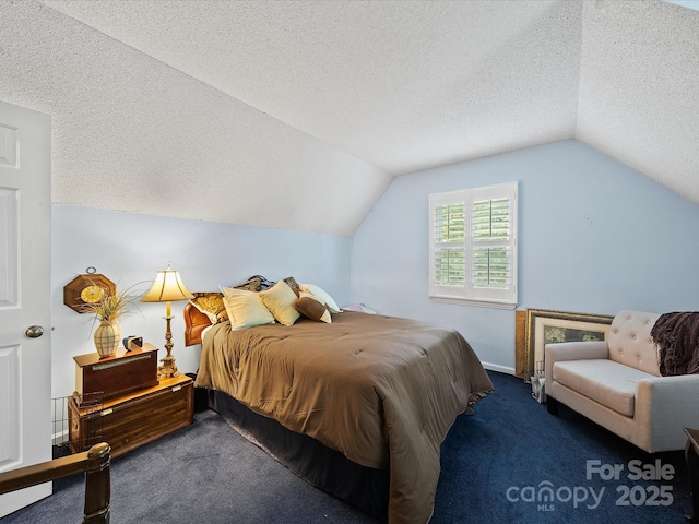 bedroom with carpet flooring, a textured ceiling, and vaulted ceiling