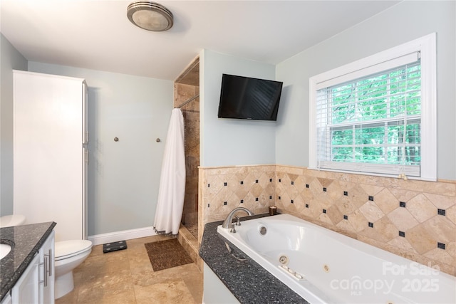 full bath featuring a shower stall, a tub with jets, vanity, baseboards, and toilet