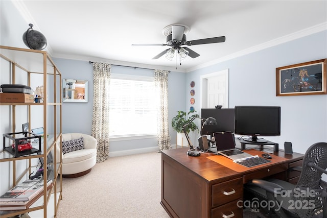 home office with crown molding, baseboards, ceiling fan, and light carpet