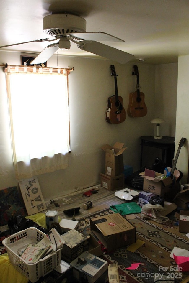 interior space featuring a ceiling fan
