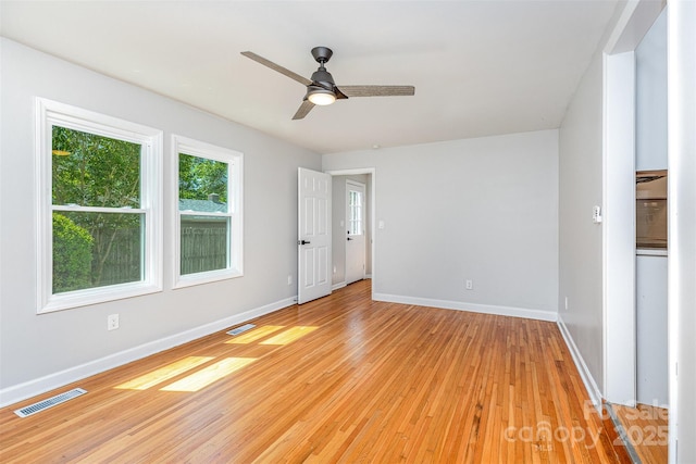 6007 Charing Pl, Charlotte, NC 28211 - unfurnished room with baseboards, light wood-style flooring, and a ceiling fan