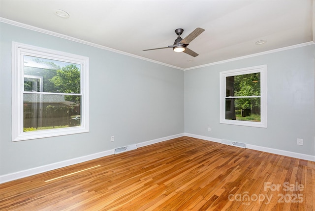 6007 Charing Pl, Charlotte, NC 28211 - empty room featuring healthy amount of natural light, light wood-style floors, ornamental molding, baseboards, and a ceiling fan
