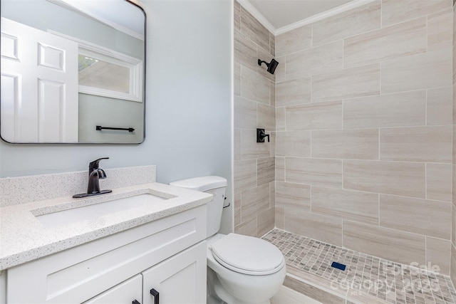 6007 Charing Pl, Charlotte, NC 28211 - bathroom with toilet, tiled shower, vanity, and ornamental molding