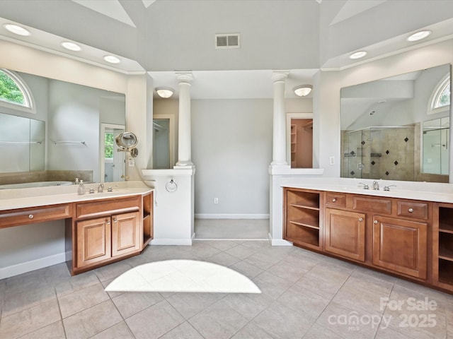 bathroom featuring visible vents, a sink, a stall shower, and a healthy amount of sunlight
