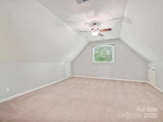 bonus room with ceiling fan, vaulted ceiling, and light colored carpet