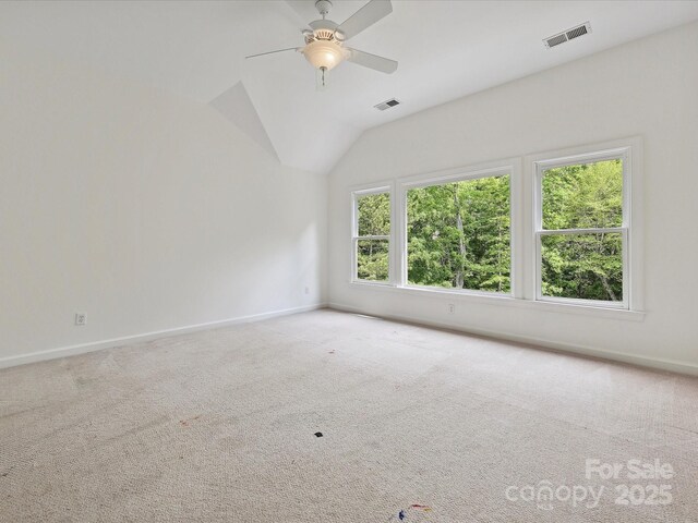empty room with visible vents, carpet flooring, and baseboards