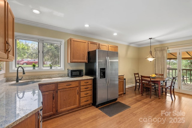 120 Cloverleaf Ln, Asheville, NC 28803 - kitchen featuring stainless steel fridge with ice dispenser, black microwave, healthy amount of natural light, light wood-style flooring, and ornamental molding
