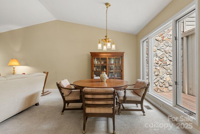 120 Cloverleaf Ln, Asheville, NC 28803 - dining area with lofted ceiling, light carpet, healthy amount of natural light, and a chandelier