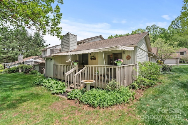 120 Cloverleaf Ln, Asheville, NC 28803 - rear view of property with a yard, a shingled roof, a chimney, and a deck