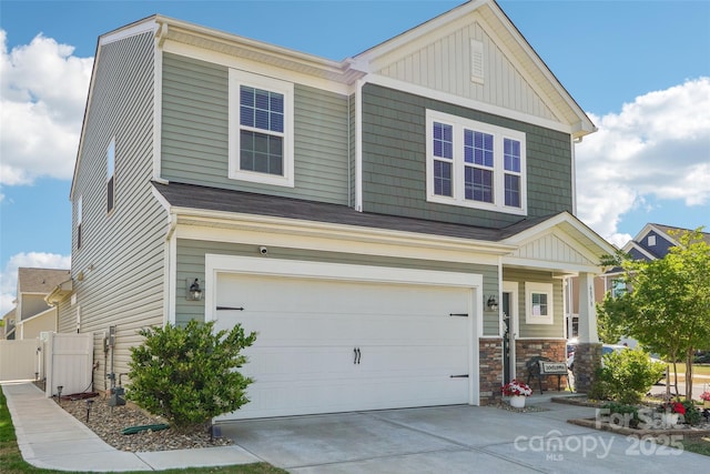 craftsman house with fence, a garage, board and batten siding, covered porch, and driveway