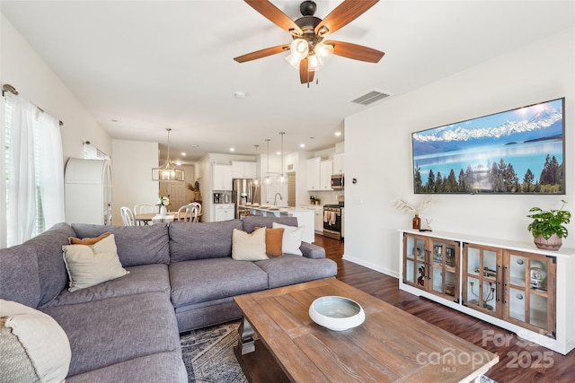 living room with recessed lighting, ceiling fan, dark wood-style flooring, and visible vents