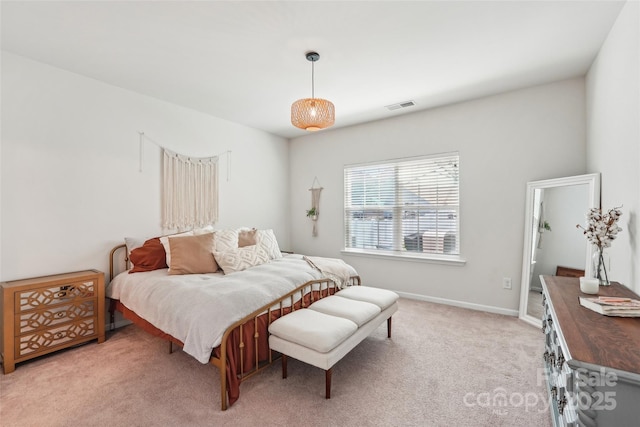 bedroom featuring light colored carpet, baseboards, and visible vents