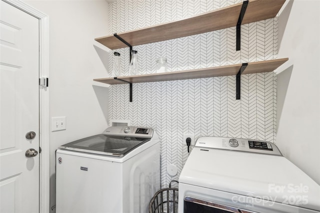 laundry room featuring laundry area and washing machine and clothes dryer