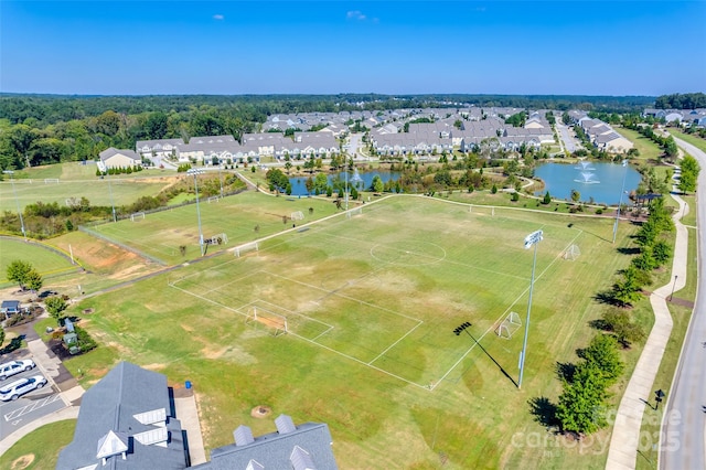 bird's eye view with a water view and a residential view