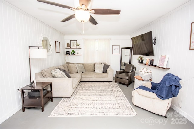 living area with crown molding and ceiling fan