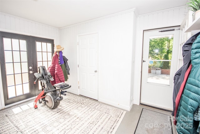 interior space featuring crown molding, baseboards, and french doors