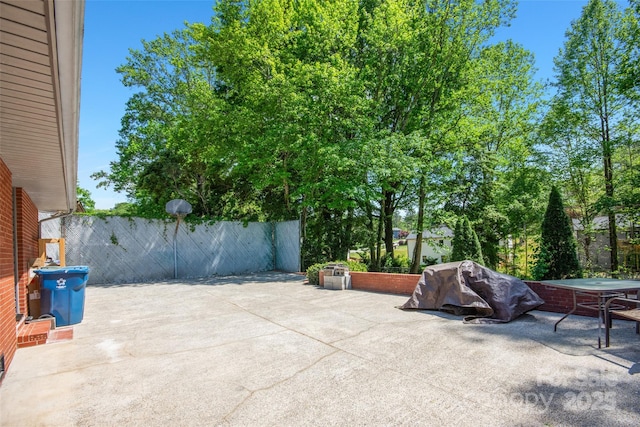 view of patio / terrace featuring fence
