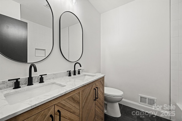 full bathroom featuring a sink, toilet, double vanity, and visible vents