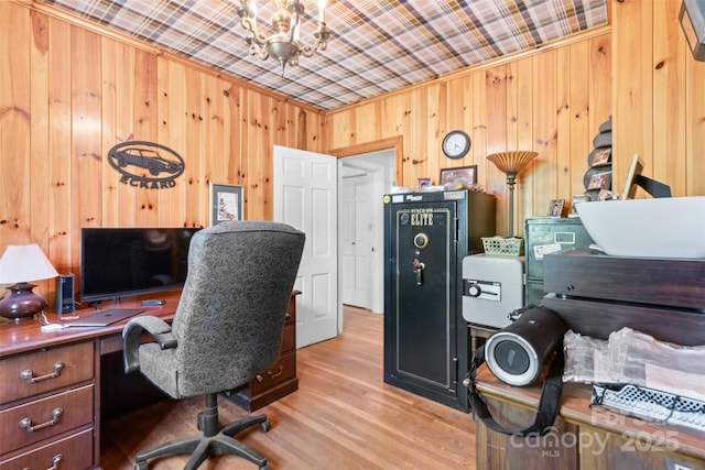 home office with wooden walls, ornamental molding, and wood finished floors