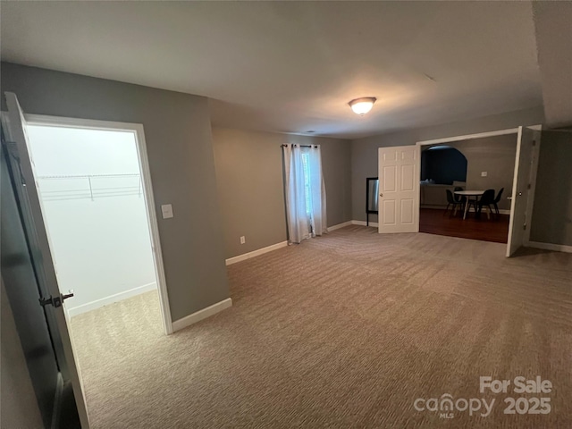interior space featuring baseboards