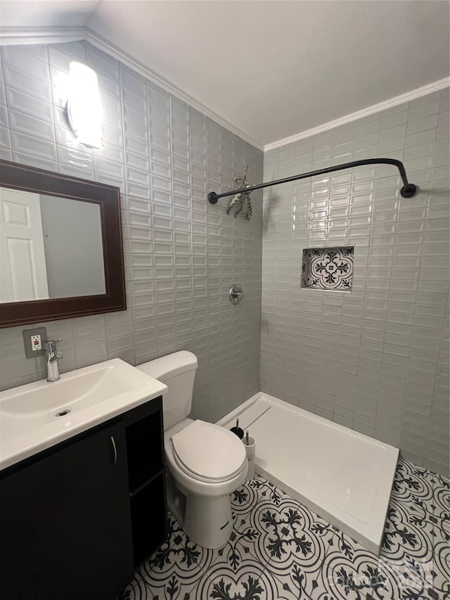 full bath featuring tile patterned flooring, vanity, toilet, tile walls, and a shower stall