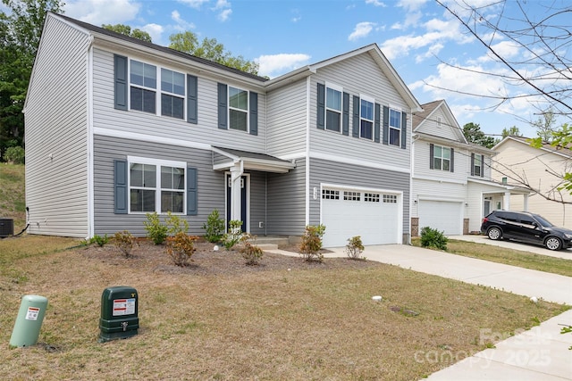 traditional-style home with a garage, concrete driveway, central AC, and a front yard