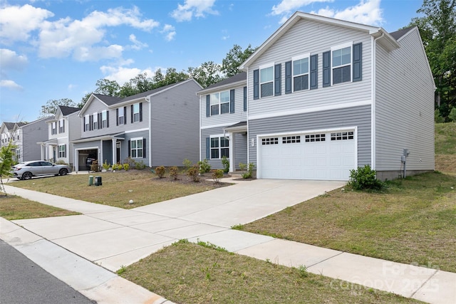 view of front of house featuring driveway, a residential view, a front yard, and a garage