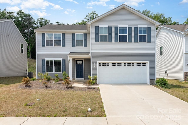 view of front of home featuring a garage, a front lawn, driveway, and central AC unit