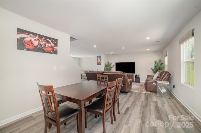 dining room with recessed lighting, light wood-style flooring, baseboards, and visible vents