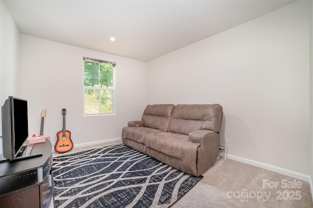 living area with baseboards and carpet flooring