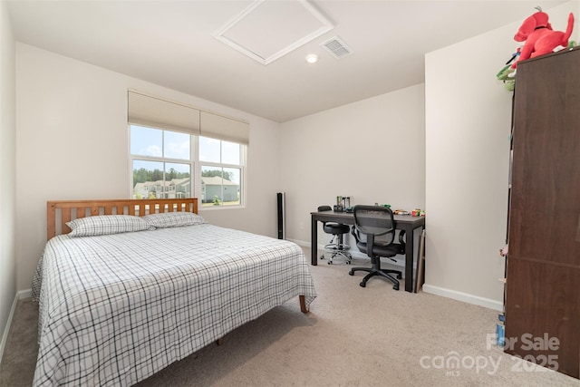 bedroom featuring carpet floors, baseboards, attic access, and visible vents