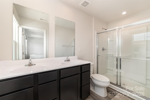 full bathroom with visible vents, a sink, and a stall shower