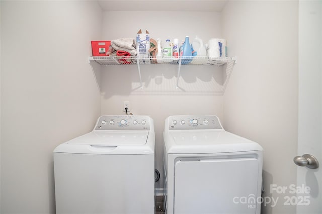 clothes washing area with laundry area and separate washer and dryer