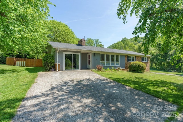 7 Lula Cove Rd, Weaverville, NC 28787 - ranch-style home with a chimney, gravel driveway, and brick siding