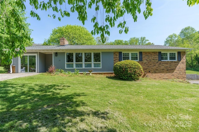 7 Lula Cove Rd, Weaverville, NC 28787 - view of front facade featuring a chimney, a front yard, and brick siding