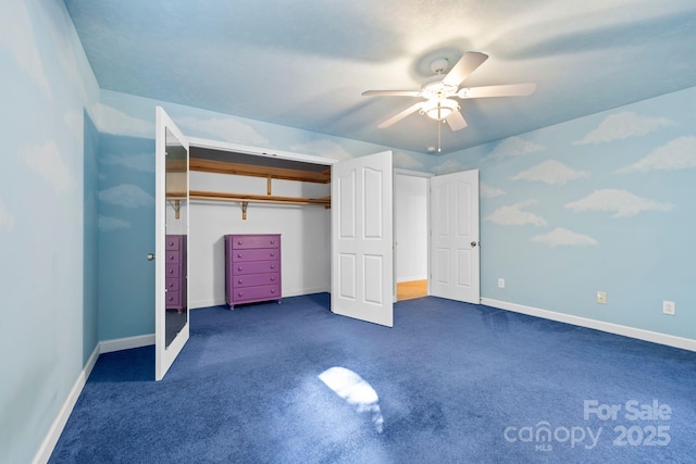 unfurnished bedroom featuring baseboards, ceiling fan, a closet, and dark colored carpet