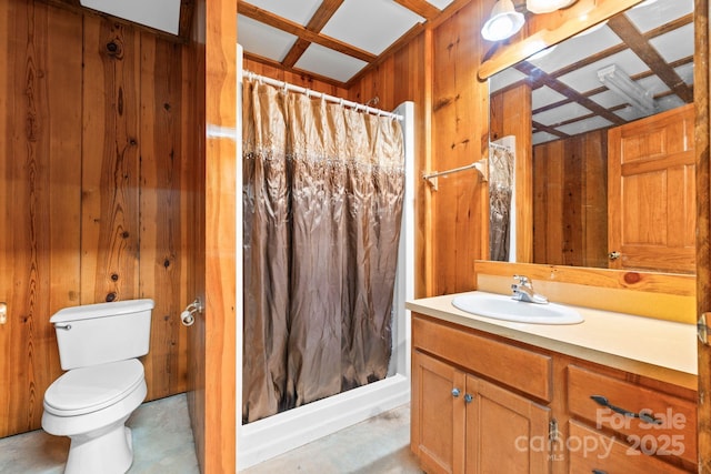 full bathroom featuring vanity, wood walls, a shower with shower curtain, and toilet