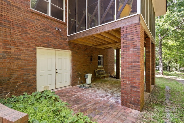 exterior space with brick siding