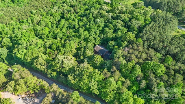 bird's eye view featuring a forest view