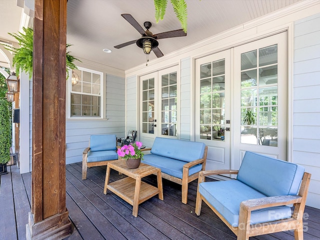 wooden terrace featuring french doors, ceiling fan, and outdoor lounge area