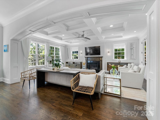 living area featuring recessed lighting, ceiling fan, a wealth of natural light, and dark wood-type flooring