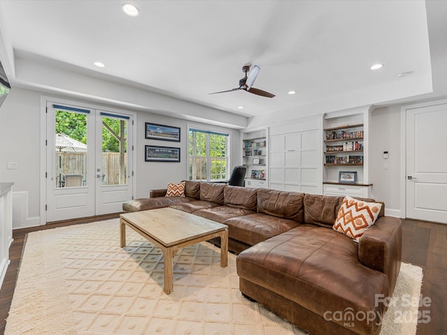 living area featuring baseboards, ceiling fan, recessed lighting, and wood finished floors