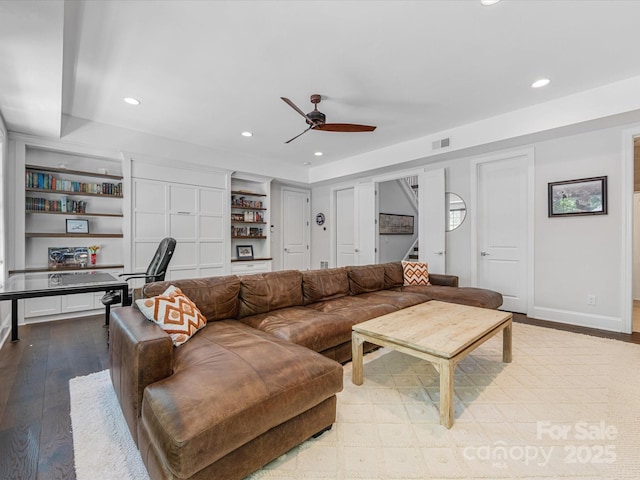 living room with a ceiling fan, visible vents, wood finished floors, recessed lighting, and stairs