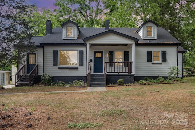 1208 Fordham Rd, Charlotte, NC 28208 - cape cod house with covered porch, a chimney, and roof with shingles
