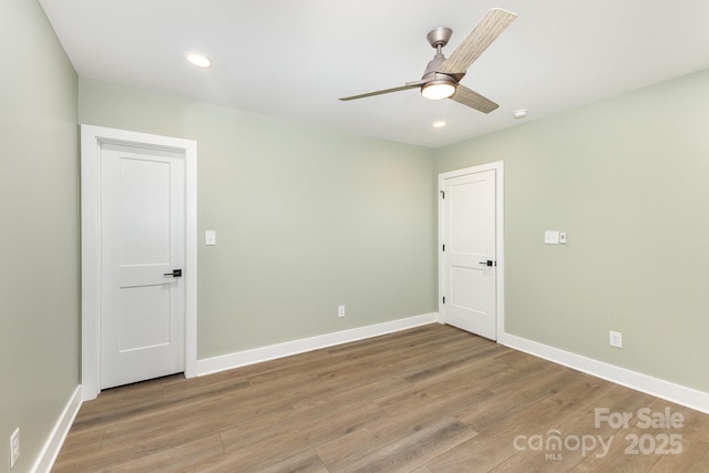 1208 Fordham Rd, Charlotte, NC 28208 - spare room with light wood finished floors, recessed lighting, baseboards, ceiling fan, and a smoke detector