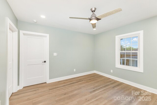 1208 Fordham Rd, Charlotte, NC 28208 - unfurnished room with light wood-style floors, a ceiling fan, baseboards, recessed lighting, and a smoke detector