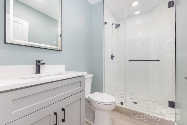 1208 Fordham Rd, Charlotte, NC 28208 - bathroom with toilet, a stall shower, and vanity