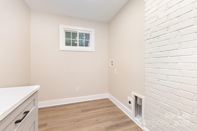 1208 Fordham Rd, Charlotte, NC 28208 - clothes washing area featuring cabinet space, hookup for a washing machine, hookup for an electric dryer, light wood-style floors, and baseboards