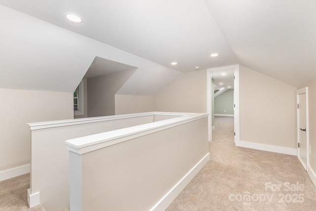 1208 Fordham Rd, Charlotte, NC 28208 - hall with light carpet, lofted ceiling, an upstairs landing, recessed lighting, and baseboards