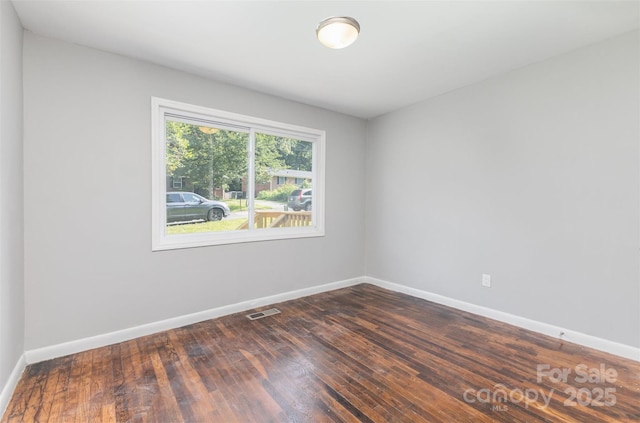 2603 Mary Ave, Gastonia, NC 28052 - empty room featuring baseboards and dark wood-style floors